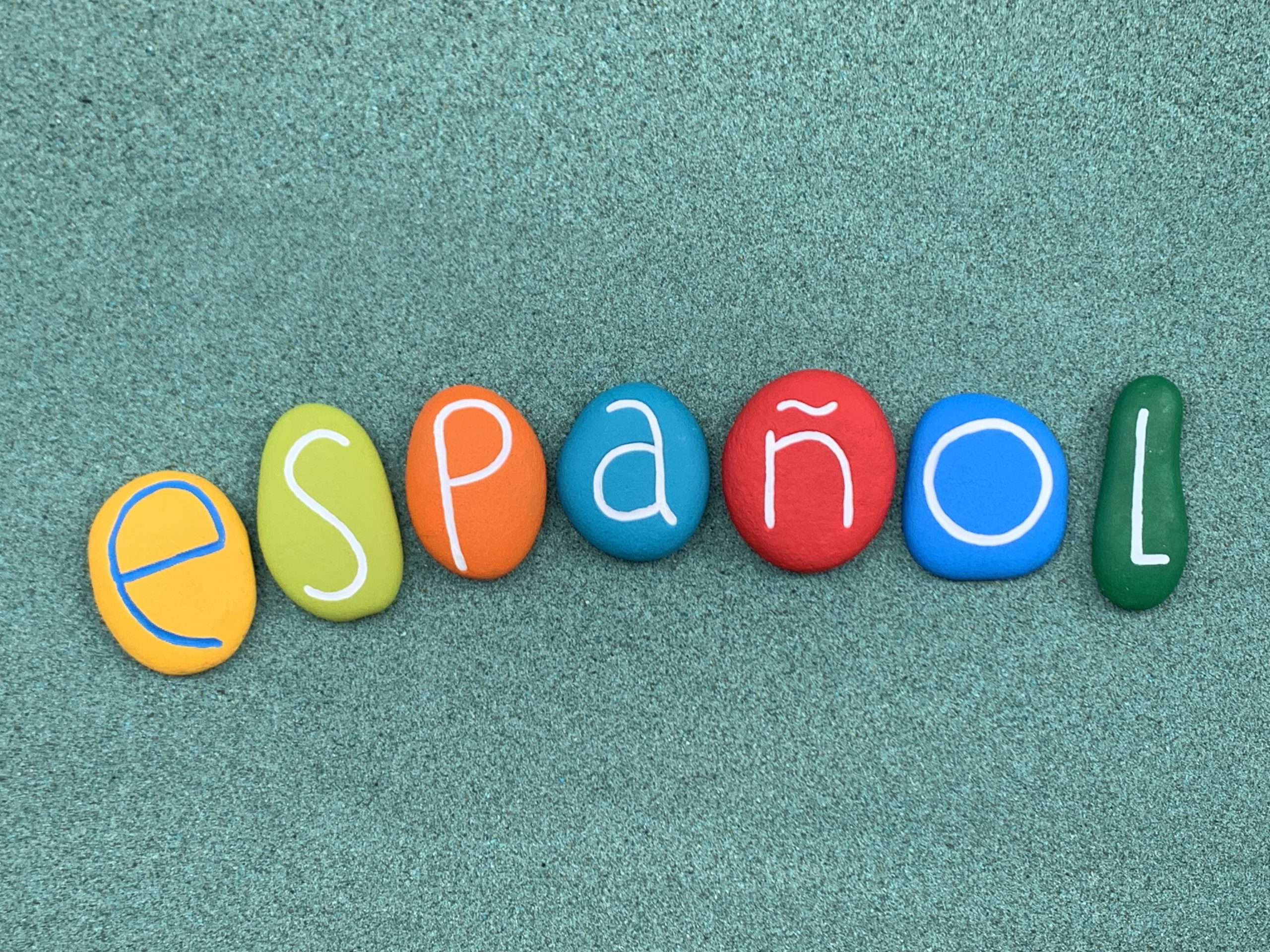 Colourful stones spelling the Spanish word español